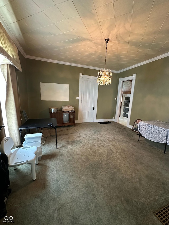 803 W 12th St, Anderson, IN 46016 - living area featuring carpet, a chandelier, crown molding, and baseboards