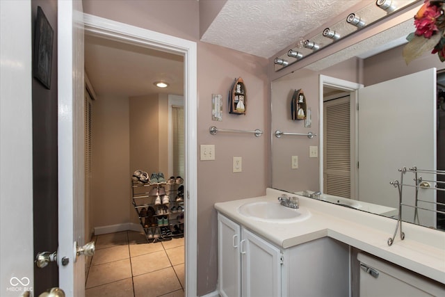 bathroom featuring tile patterned floors and vanity