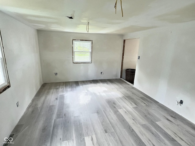 unfurnished room featuring light wood-style floors