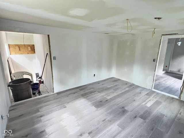 empty room featuring wood finished floors