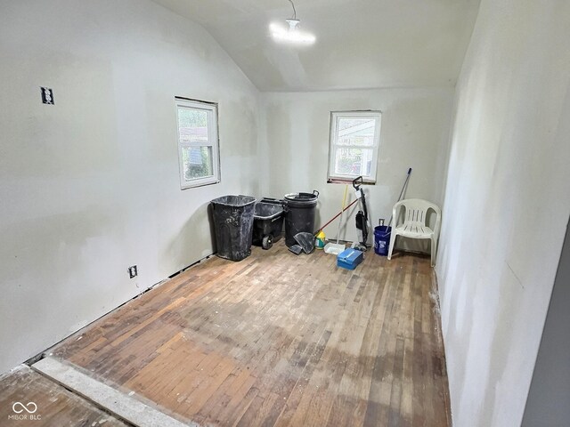 bonus room featuring vaulted ceiling and hardwood / wood-style floors