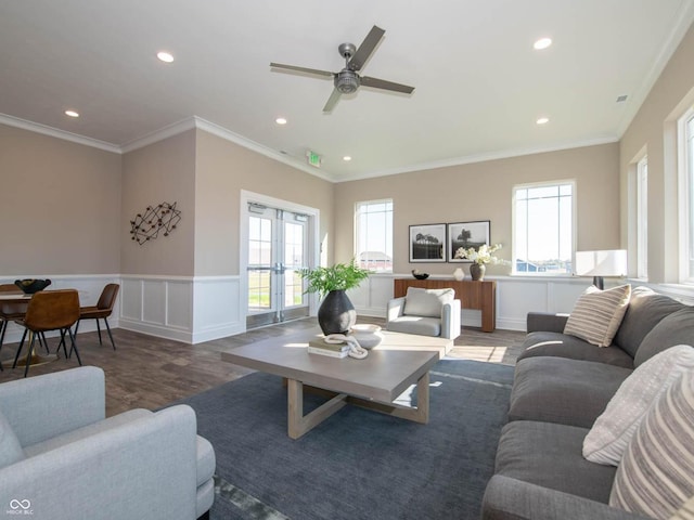 living area with wood finished floors, ceiling fan, recessed lighting, a wainscoted wall, and french doors