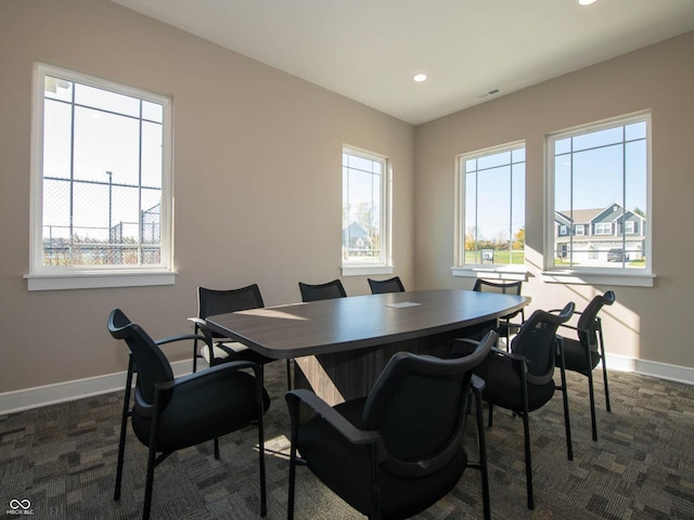 office space with baseboards, recessed lighting, and dark carpet