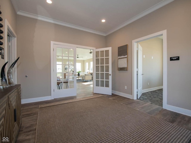 empty room with french doors, wood finished floors, ornamental molding, baseboards, and recessed lighting