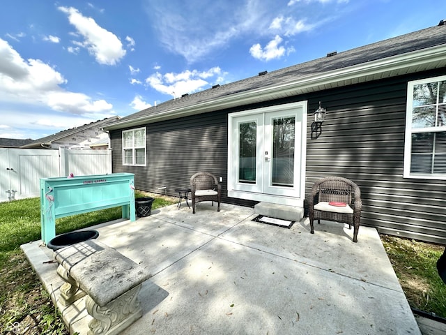 view of patio / terrace with french doors and fence