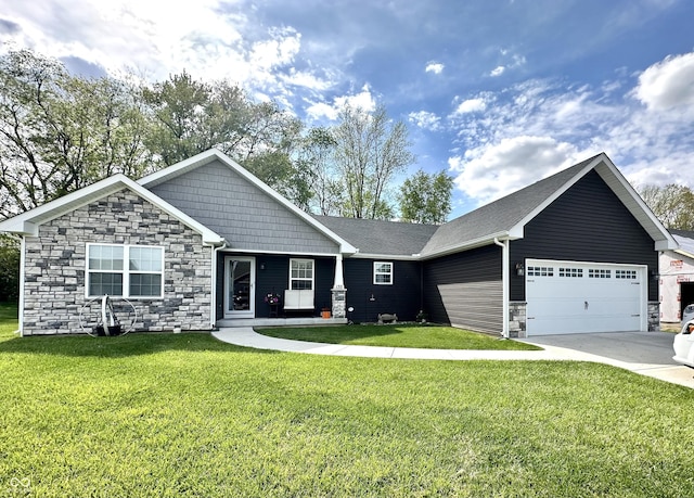 view of front of house with stone siding, a garage, a front yard, and driveway