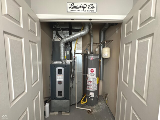 utility room featuring water heater and heating unit