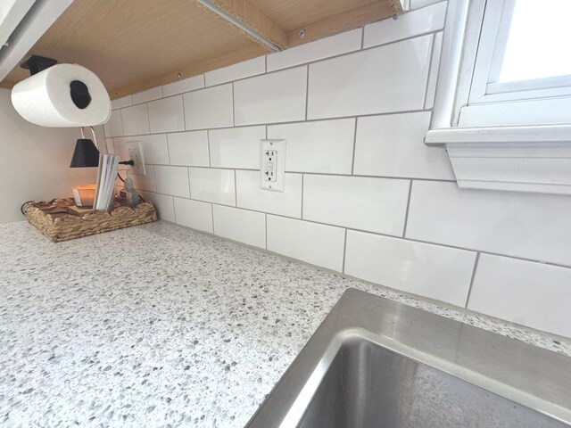 kitchen view of backsplash and light countertops