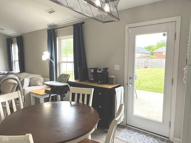 dining area with wood finished floors