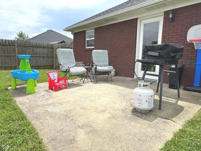 view of patio / terrace with fence and grilling area