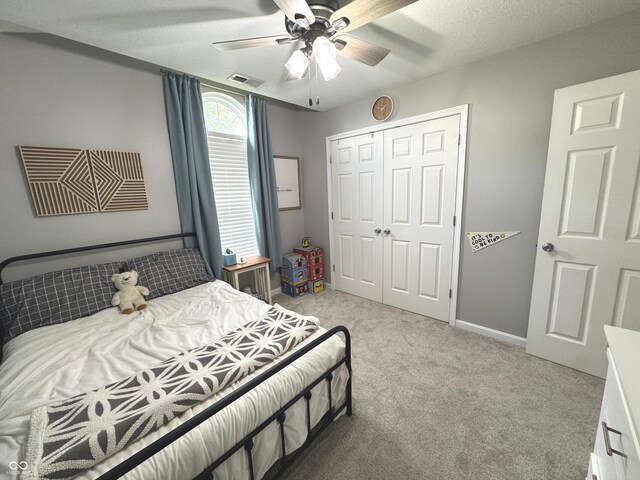 bedroom featuring carpet flooring, a closet, a ceiling fan, and baseboards