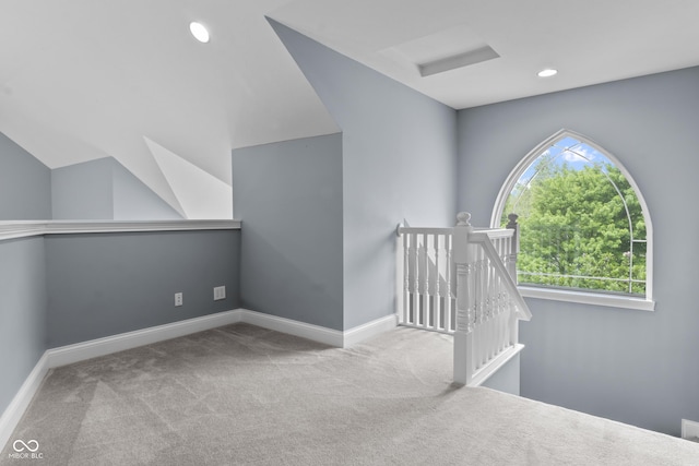 additional living space with carpet flooring, baseboards, lofted ceiling, and recessed lighting