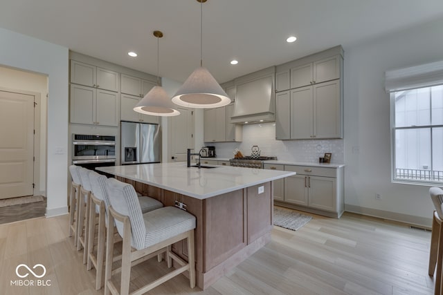 17346 Newton Main St, Westfield, IN 46074 - kitchen with premium range hood, gray cabinets, appliances with stainless steel finishes, a sink, and backsplash