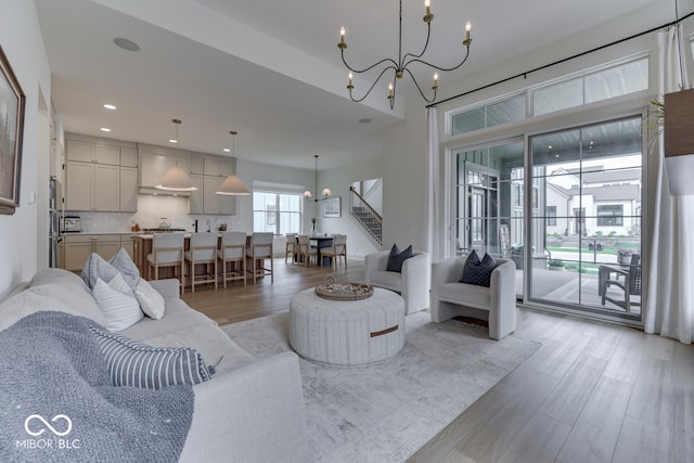 17346 Newton Main St, Westfield, IN 46074 - living area featuring a chandelier, stairway, light wood-style flooring, and recessed lighting