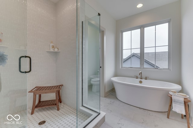 17346 Newton Main St, Westfield, IN 46074 - bathroom featuring a stall shower, a soaking tub, and toilet