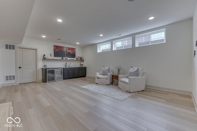 17346 Newton Main St, Westfield, IN 46074 - sitting room featuring bar area, light wood-type flooring, recessed lighting, and baseboards