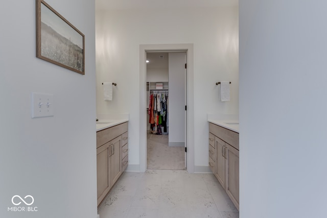 17346 Newton Main St, Westfield, IN 46074 - full bath with two vanities, marble look tile flooring, baseboards, and a walk in closet