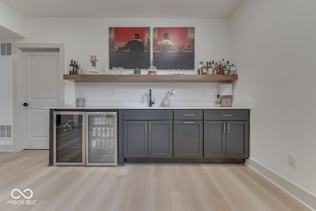 17346 Newton Main St, Westfield, IN 46074 - indoor wet bar with wine cooler and light wood-style floors