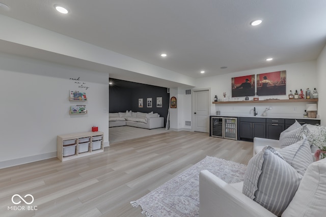 17346 Newton Main St, Westfield, IN 46074 - living room with wet bar, recessed lighting, light wood-type flooring, baseboards, and wine cooler