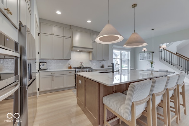 17346 Newton Main St, Westfield, IN 46074 - kitchen with gray cabinets, stainless steel appliances, backsplash, a sink, and recessed lighting