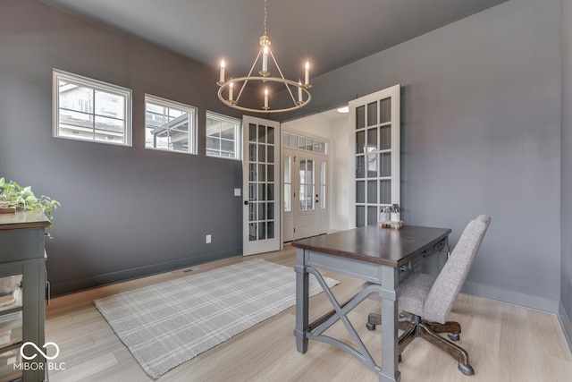 17346 Newton Main St, Westfield, IN 46074 - unfurnished office featuring a chandelier, light wood finished floors, french doors, and plenty of natural light