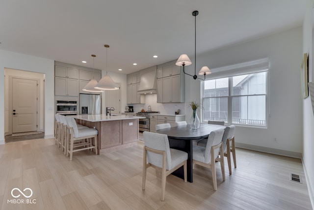 17346 Newton Main St, Westfield, IN 46074 - dining space with light wood-style floors, baseboards, and recessed lighting