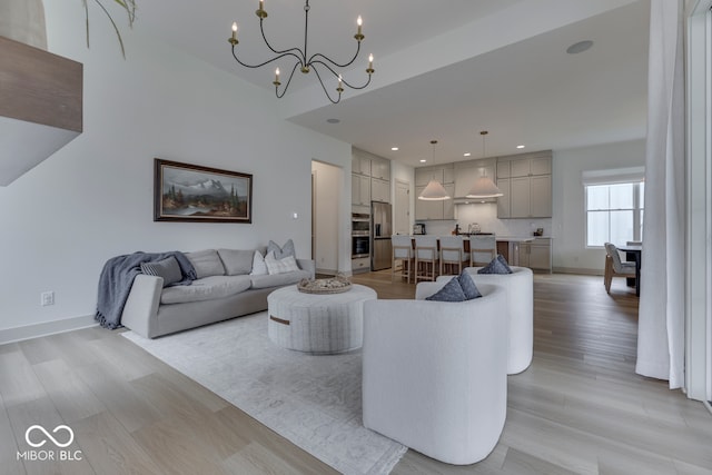 17346 Newton Main St, Westfield, IN 46074 - living room with a chandelier, light wood-style flooring, baseboards, and recessed lighting