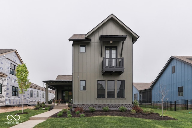 17346 Newton Main St, Westfield, IN 46074 - view of front of property with board and batten siding, a balcony, covered porch, and roof with shingles