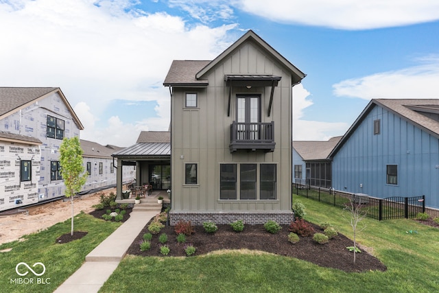 17346 Newton Main St, Westfield, IN 46074 - modern farmhouse with board and batten siding, a balcony, covered porch, roof with shingles, and a standing seam roof