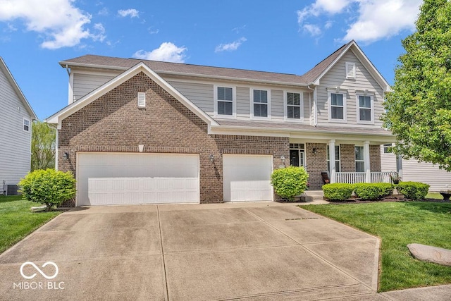 9712 Brooks Dr, Mccordsville, IN 46055 - traditional-style house featuring brick siding, covered porch, a front lawn, and concrete driveway