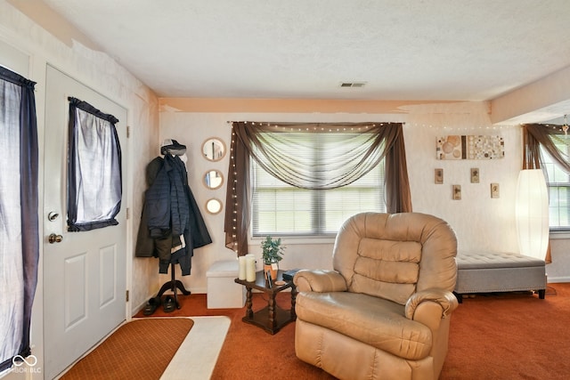 living area with carpet floors and baseboards