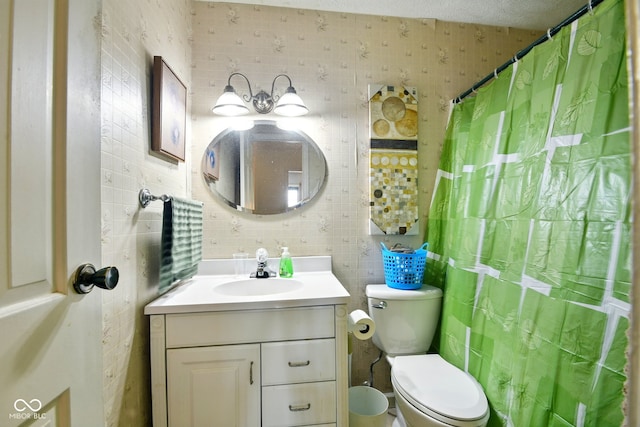 bathroom with toilet, vanity, tasteful backsplash, and tile walls