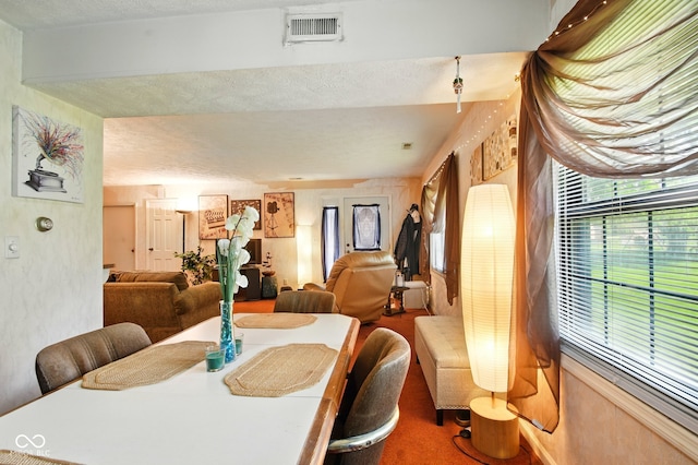 dining room featuring carpet flooring