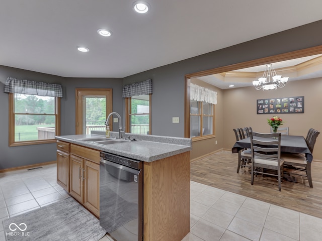 kitchen featuring a sink, dishwasher, a chandelier, light tile patterned flooring, and recessed lighting