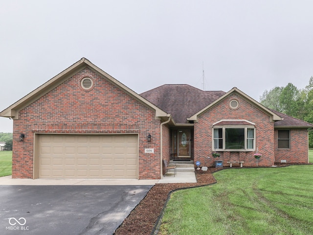 ranch-style home with brick siding, asphalt driveway, a front yard, a shingled roof, and an attached garage