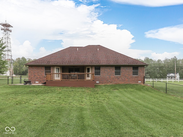 back of house with brick siding and roof with shingles