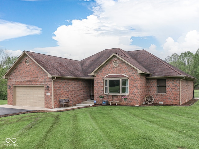 ranch-style house with brick siding, a garage, a front yard, and driveway