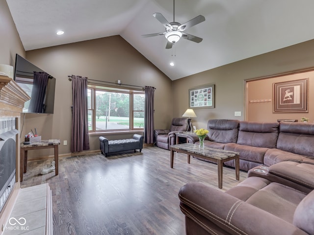 living area featuring a ceiling fan, high vaulted ceiling, light wood-style floors, recessed lighting, and baseboards