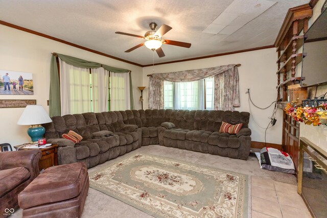 455 E Main St, Danville, IN 46122 - living area with a ceiling fan, ornamental molding, light colored carpet, a glass covered fireplace, and light tile patterned floors