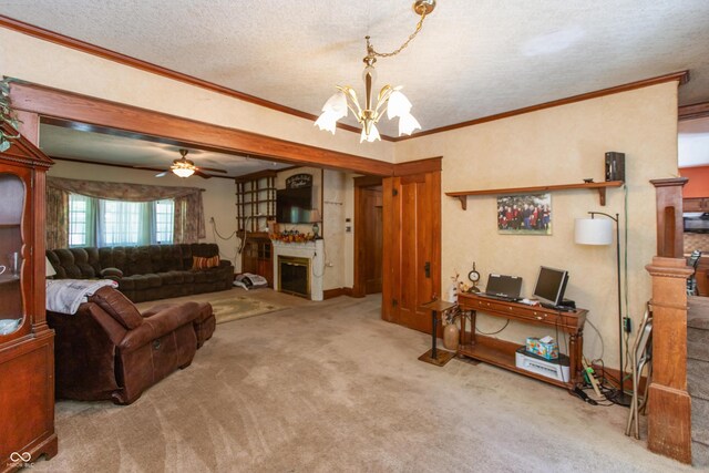 455 E Main St, Danville, IN 46122 - living room with crown molding, carpet floors, a chandelier, a glass covered fireplace, and ceiling fan