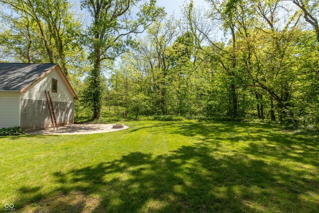 455 E Main St, Danville, IN 46122 - view of green lawn with an outdoor structure and a garage