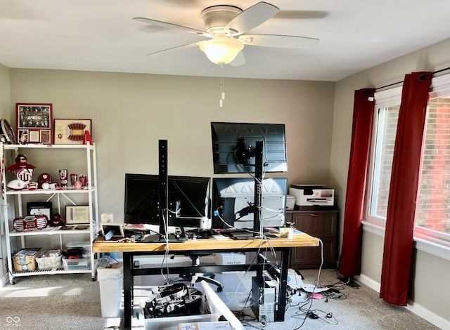 office with carpet floors, a ceiling fan, and baseboards