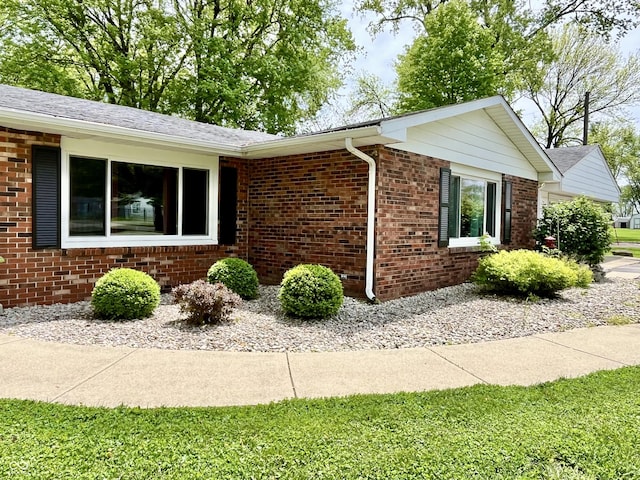 view of home's exterior featuring brick siding