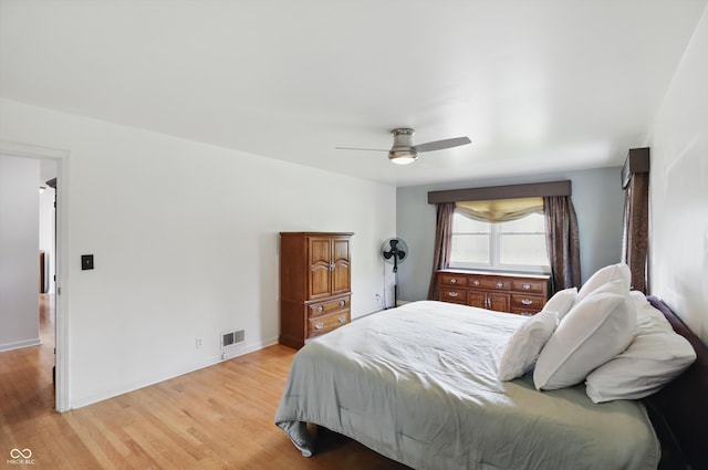 6825 Farmleigh Dr, Indianapolis, IN 46220 - bedroom with light wood-style floors, baseboards, and a ceiling fan