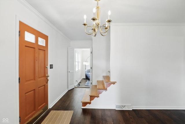 6825 Farmleigh Dr, Indianapolis, IN 46220 - foyer featuring a chandelier, dark wood finished floors, ornamental molding, and baseboards