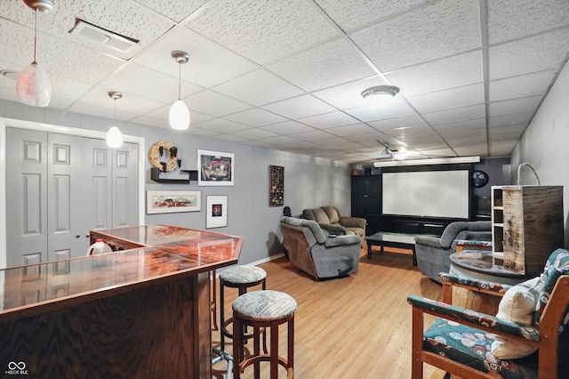 6825 Farmleigh Dr, Indianapolis, IN 46220 - home theater room with wood finished floors, baseboards, and a drop ceiling