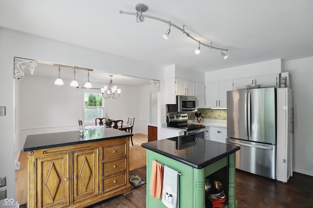 6825 Farmleigh Dr, Indianapolis, IN 46220 - kitchen with stainless steel appliances, white cabinetry, dark countertops, and dark wood-type flooring