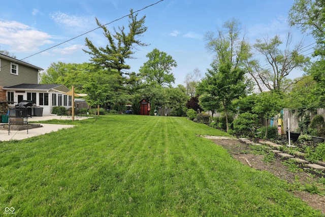 6825 Farmleigh Dr, Indianapolis, IN 46220 - view of yard featuring a patio area, a storage unit, and an outdoor structure