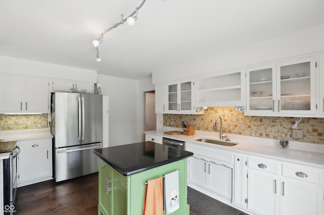 6825 Farmleigh Dr, Indianapolis, IN 46220 - kitchen with appliances with stainless steel finishes, a sink, backsplash, and white cabinetry