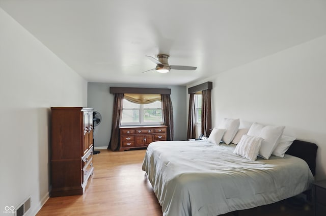 6825 Farmleigh Dr, Indianapolis, IN 46220 - bedroom featuring light wood-type flooring, ceiling fan, and baseboards